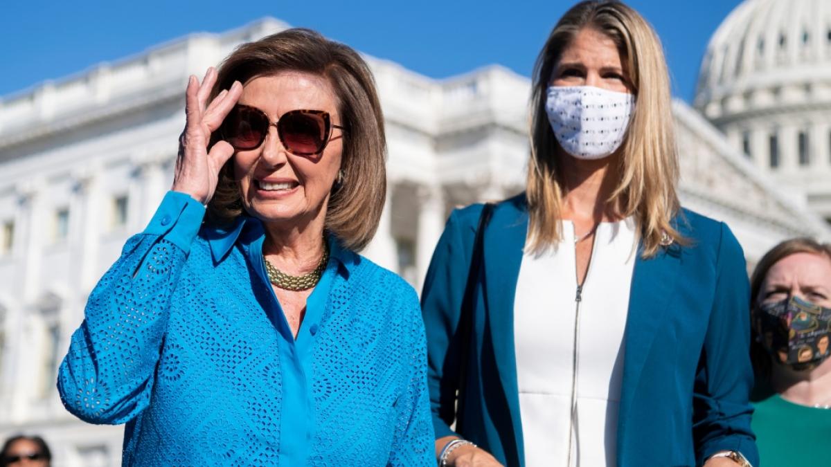 House Speaker Nancy Pelosi, D-Calif., conducts a news conference on the abortion rights bill outside of the Capitol on Friday. Reps. Lori Trahan, D-Mass., and Lizzie Fletcher, D-Texas, right, also appear. (Tom Williams/CQ Roll Call)
